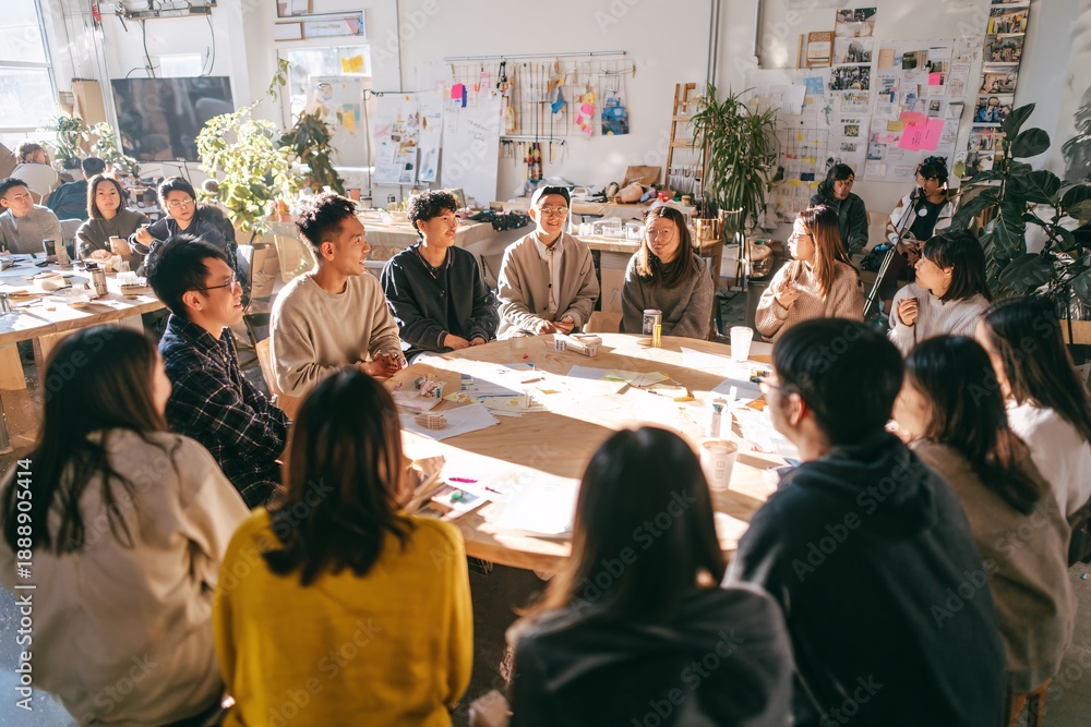 Obraz premium Diverse team collaborating in modern office space with creative atmosphere