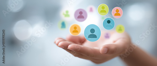 Wallpaper Mural A blurred hand holds a cluster of colorful, abstract people icons in a digital style. Torontodigital.ca