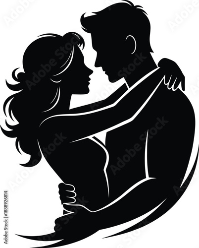 Silhouette of a romantic young couple embracing closely with the woman's arms around the man's neck in a tender moment of love.
