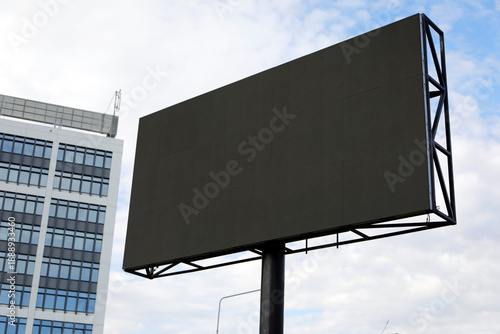 Blank LED digital billboard next to a business centre, big digital screen outdoor display for video advertising media for mock-up