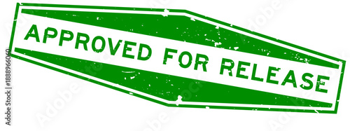 Grunge green approved for release word hexagon seal stamp on white background