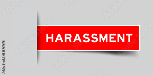 Photos Red color square shape sticker label with word harassment inserted in gray backg