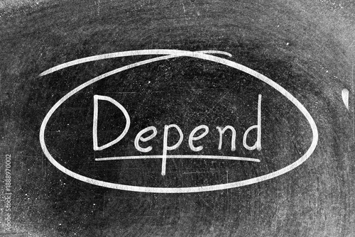 White chalk hand writing in word depend and circle shape on blackboard background