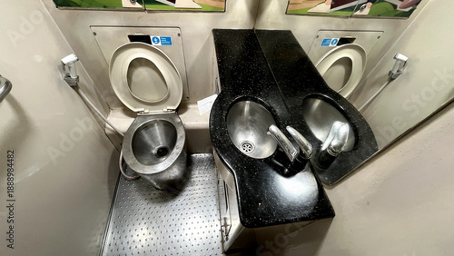 Εκτύπωση καμβά Interior of a passenger train toilet featuring a stainless steel toilet bowl, du