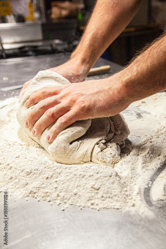 Obraz na plátně hands kneading dough on table