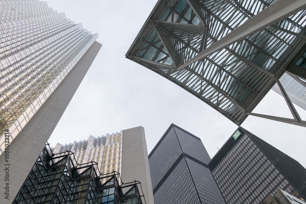Fototapeta premium looking up at towers in the financial district including the Allen Lambert Galleria canopy at Brookfield Place, with Royal Bank Plaza and TD Centre, Toronto