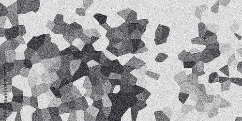 Abstract grayscale mosaic pattern with grainy texture and irregular polygonal shapes creating a textured background for design and digital art applications