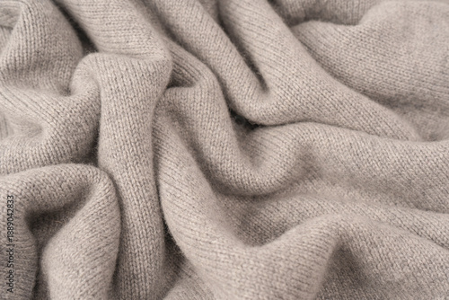 Soft grey merino wool sweater texture as a background.