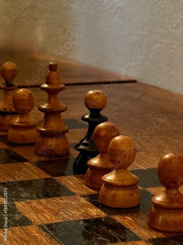 dark and light chess pieces on a chessboard