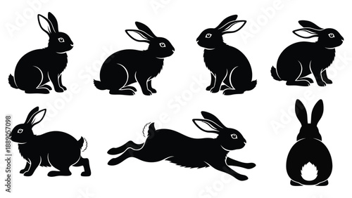 Set of black running and standing rabbit silhouettes in various poses..eps