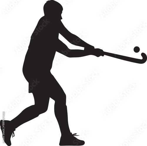 Silhouette of a field hockey player in action with stick and ball