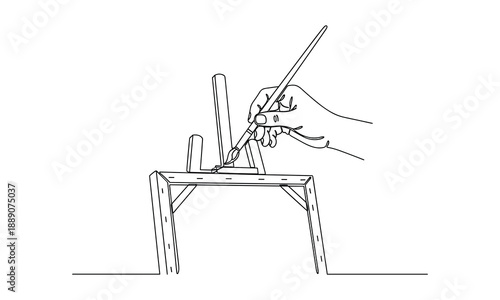 Hand holding paintbrush to canvas on a close-up easel, line art