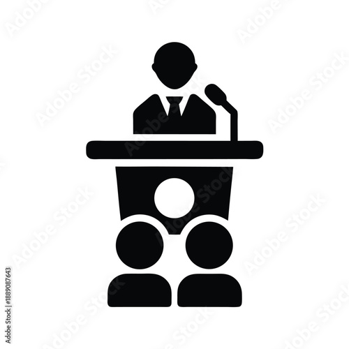 A silhouetted speaker stands behind a podium addressing an audience in a solid black icon