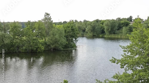 Wallpaper Mural Scenic panoramic view of a wide river surrounded by lush green forest Torontodigital.ca