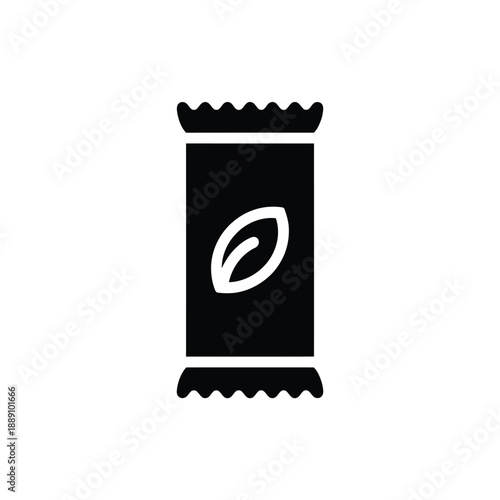 Simple black and white icon depicting a tea bag with a leaf