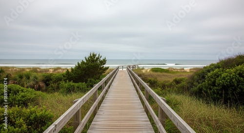 Wallpaper Mural Pathway to Paradise: A wooden boardwalk beckons toward the tranquil horizon where the sea meets the sky on a serene day, offering a journey toward the boundless ocean. Torontodigital.ca