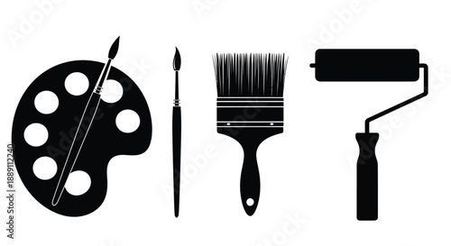 A collection of artistic tools including a paint palette brushes and a roller for creative projects