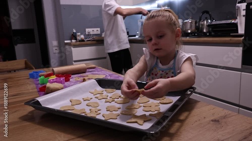 Wallpaper Mural Little child cutting gingerbread dough with star and triangle cookie cutters at home Torontodigital.ca