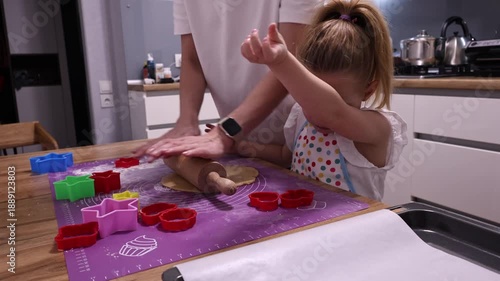 Wallpaper Mural Top view of a child preparing organic gingerbread cookies on a wooden table Torontodigital.ca