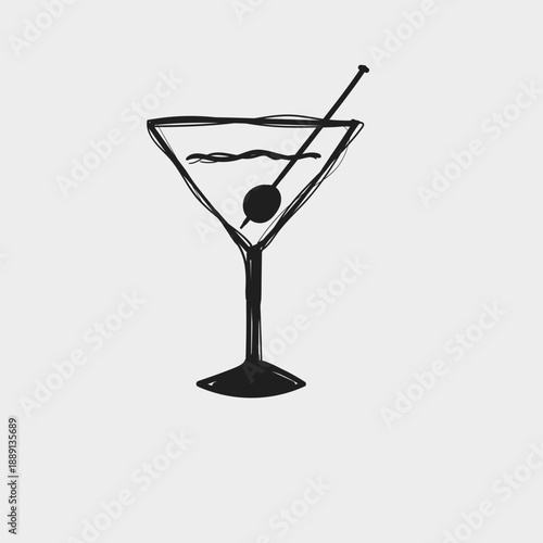 Classic martini on a white background in a simple glass with an olive on a stick