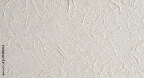 Close-up view of crumpled white paper texture on a flat surface