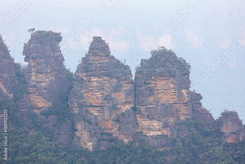 Photograph of the famous Three Sisters rock formation at Echo Point in the town of Katoomba in the Blue Mountains in New South Wales, Australia.