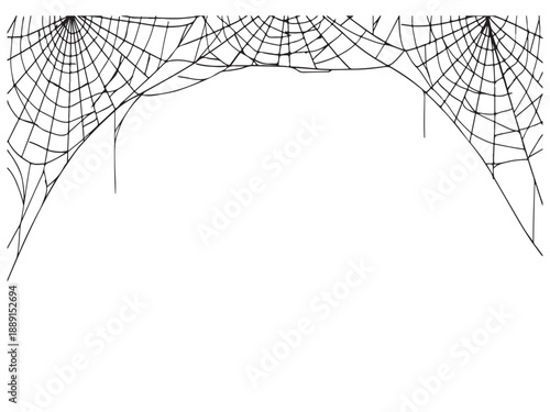Cobwebs stretched across a frame or doorway in a spooky and abandoned environment  creepy Halloween decorations
