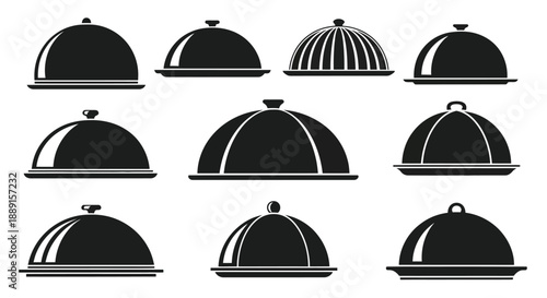 Collection of black and white serving dishes with dome shaped lids