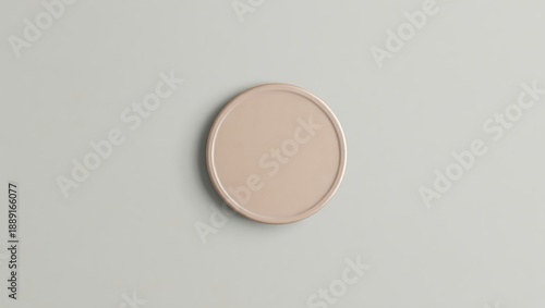 beige circular object on gray surface