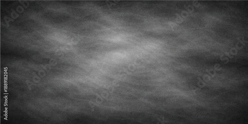 A dark and dirty vintage grunge metal surface featuring an old black and white concrete wall texture with a grey blank chalkboard design pattern
