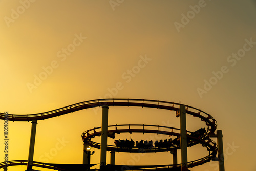 Фотография Sunset Silhouette: Roller Coaster Over California Coast