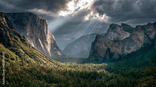 Ultra HD Dramatic sun rays over yosemite valley with el capitan and dense forest under a cloudy sky, showcasing the majestic natural beauty video