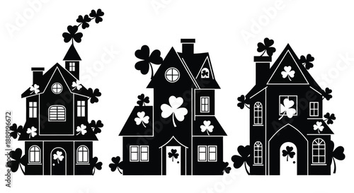 Three black silhouette houses decorated with shamrocks for st patrick s day