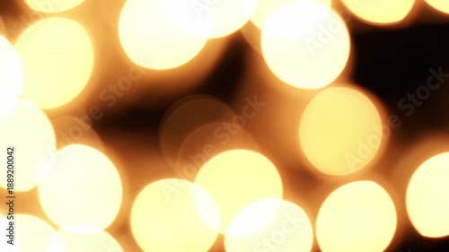 abstract blurred bokeh christmas lights in darkness