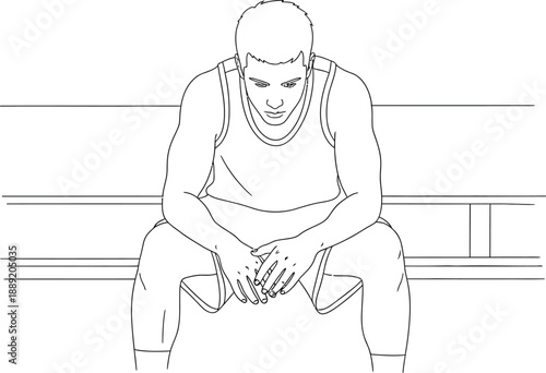 A determined male athlete sitting on a bench in a contemplative or frustrated state during a sports event