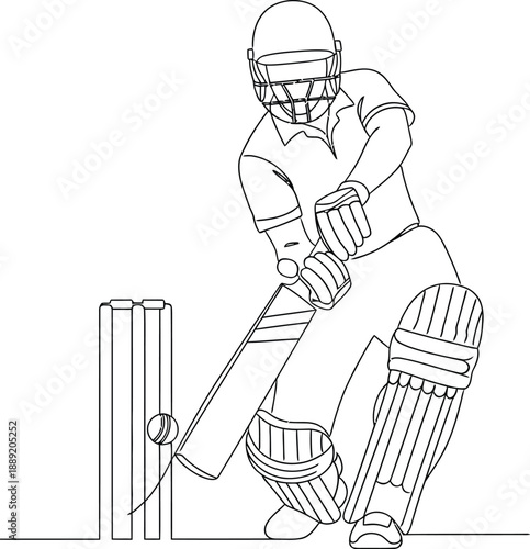 Cricket player in action hitting a ball with a bat during a match with protective gear