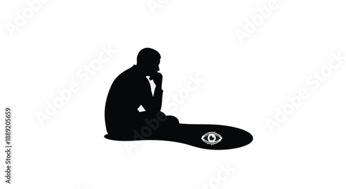 Man sitting in contemplation with skateboard beside him