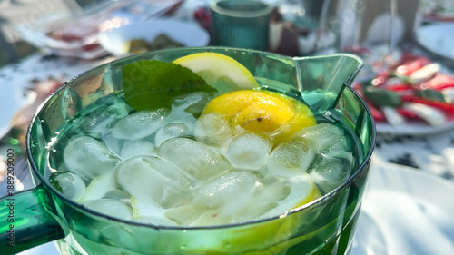 Photography Chilled emerald jug of zesty lemon-mint infusion evokes midsummer vitality, idea