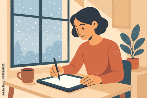 Woman draws on tablet by window with snow falling outside during winter afternoon