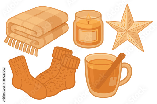 Cozy items for a warm evening at home with blankets, candles, and a drink