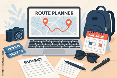Planning a trip with a laptop, travel calendar, tickets, and camera on a desk