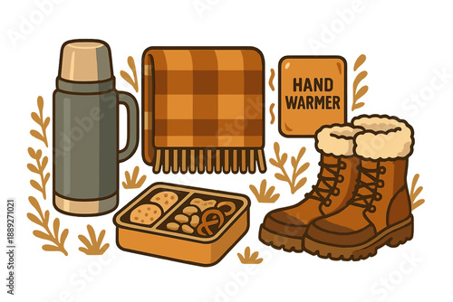 Hiking equipment and picnic items laid out for an outdoor trip in the fall season with a cozy theme