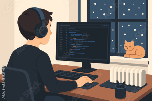 Person works on computer during winter night with cat resting on windowsill