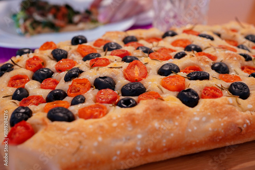 Homemade Italian Focaccia with Black Olives, Cherry Tomatoes, and Rosemary