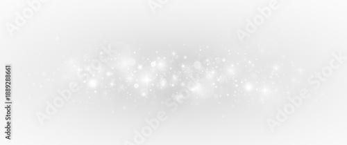 Glowing decoration with sparkling stardust and silver shimmer. Festive background with luxury glitter particles and bright light.