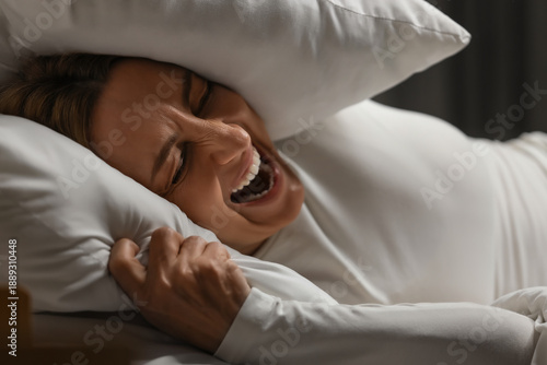 Angry mature woman with pil...