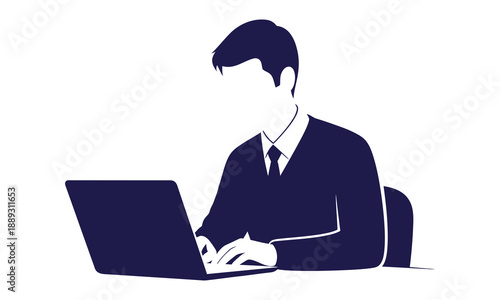 Businessman working on laptop computer in office setting