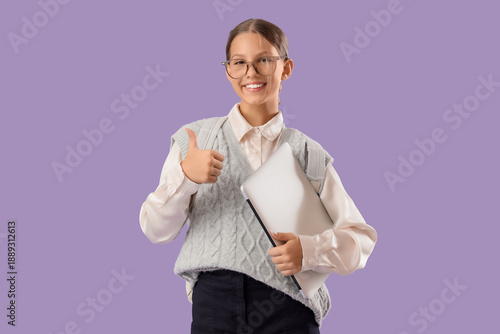 Female student with laptop ...