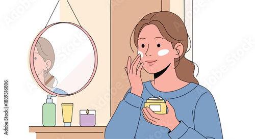 A woman applies cream to her face in front of a mirror with skincare products on a shelf.