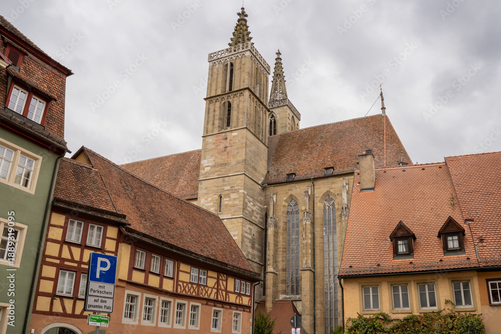 Obraz premium St. Jakobskirche in Rothenburg ob der Tauber, Bavaria, Germany. Gothic medieval church with twin towers, stained glass and famous Holy Blood altarpiece, iconic European travel landmark.